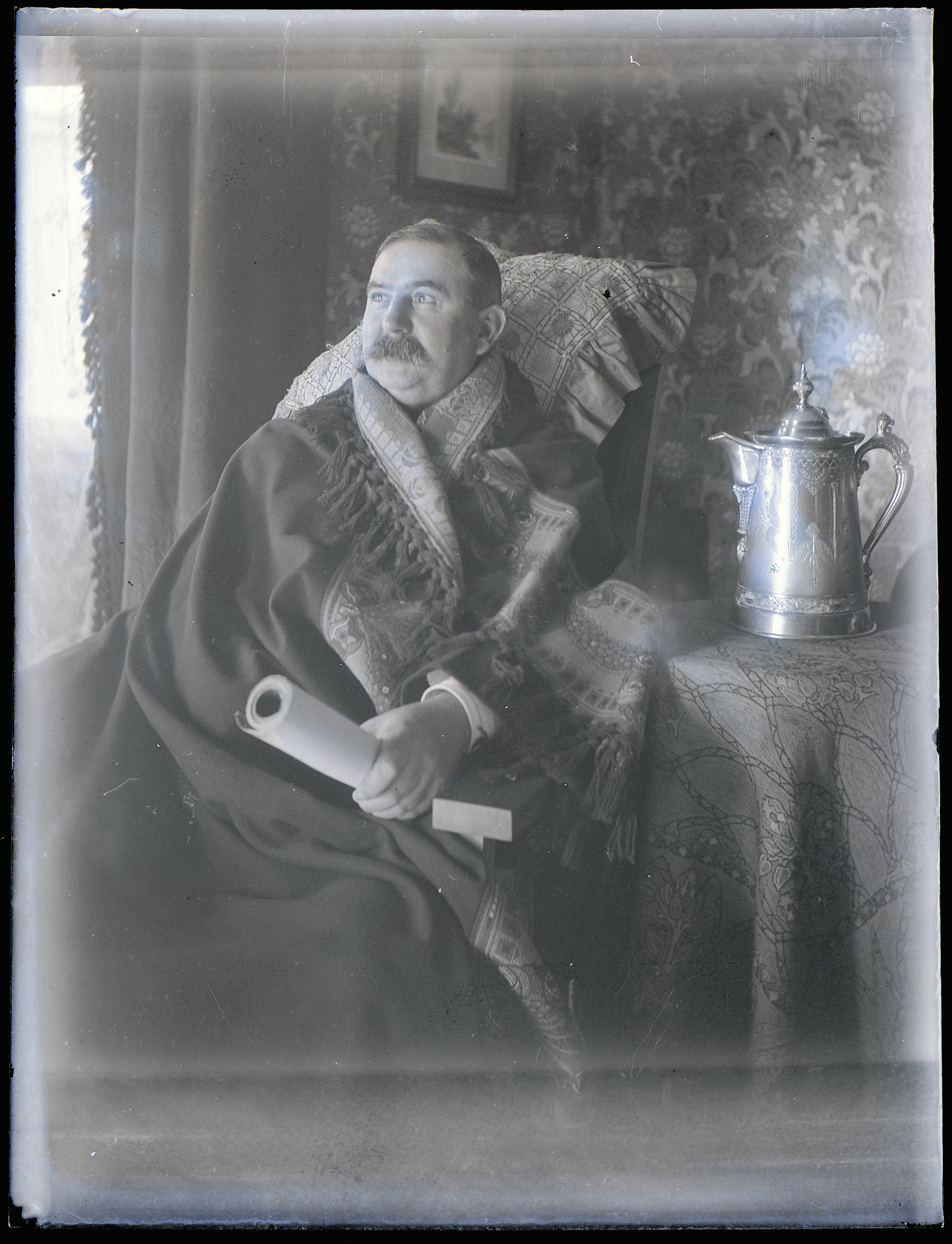 Gulliver photographs. &#39;Seated man holding a scroll&#39;.